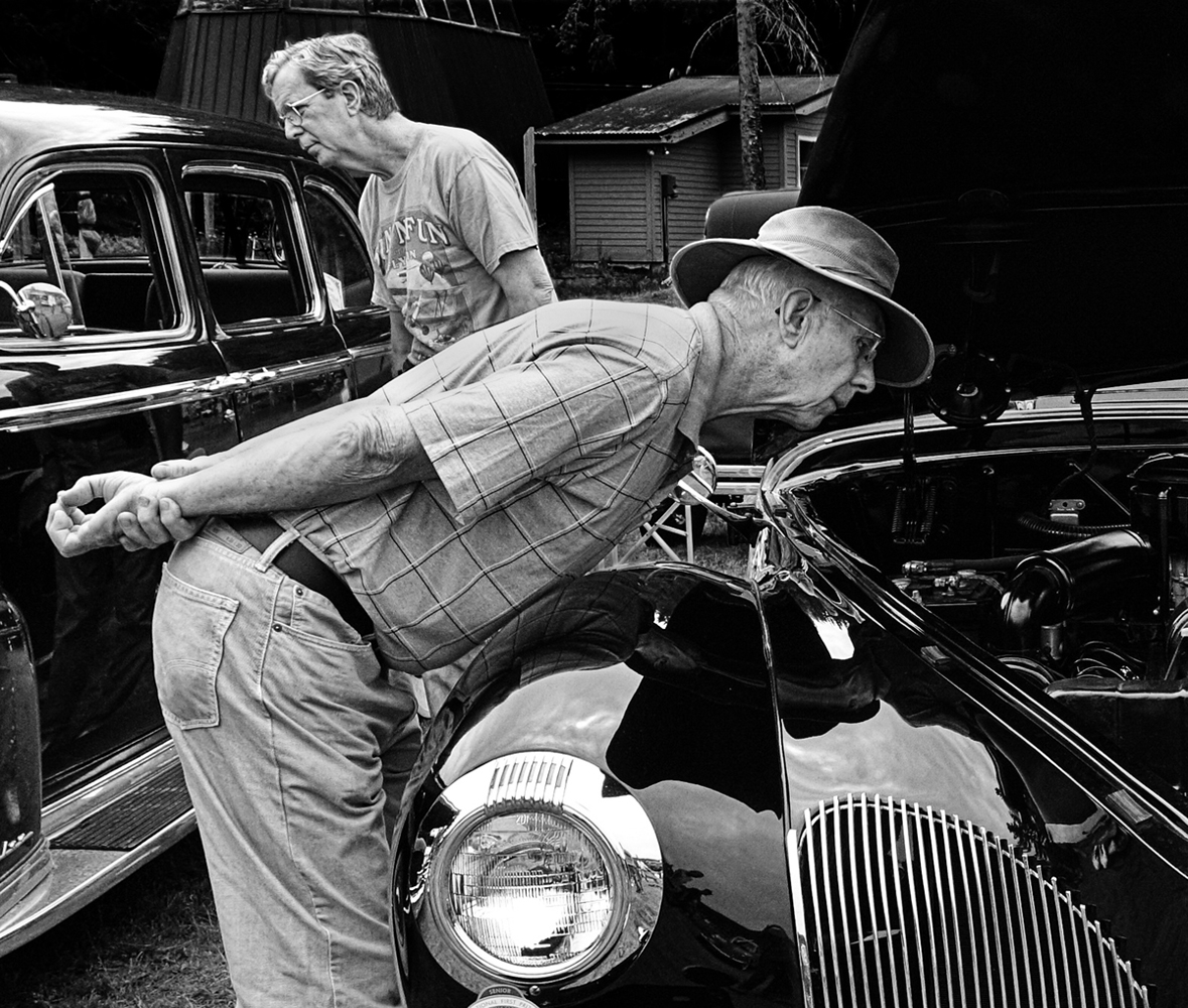 Street photography, antique car show, old men, peer into engine, Sunapee, NH
